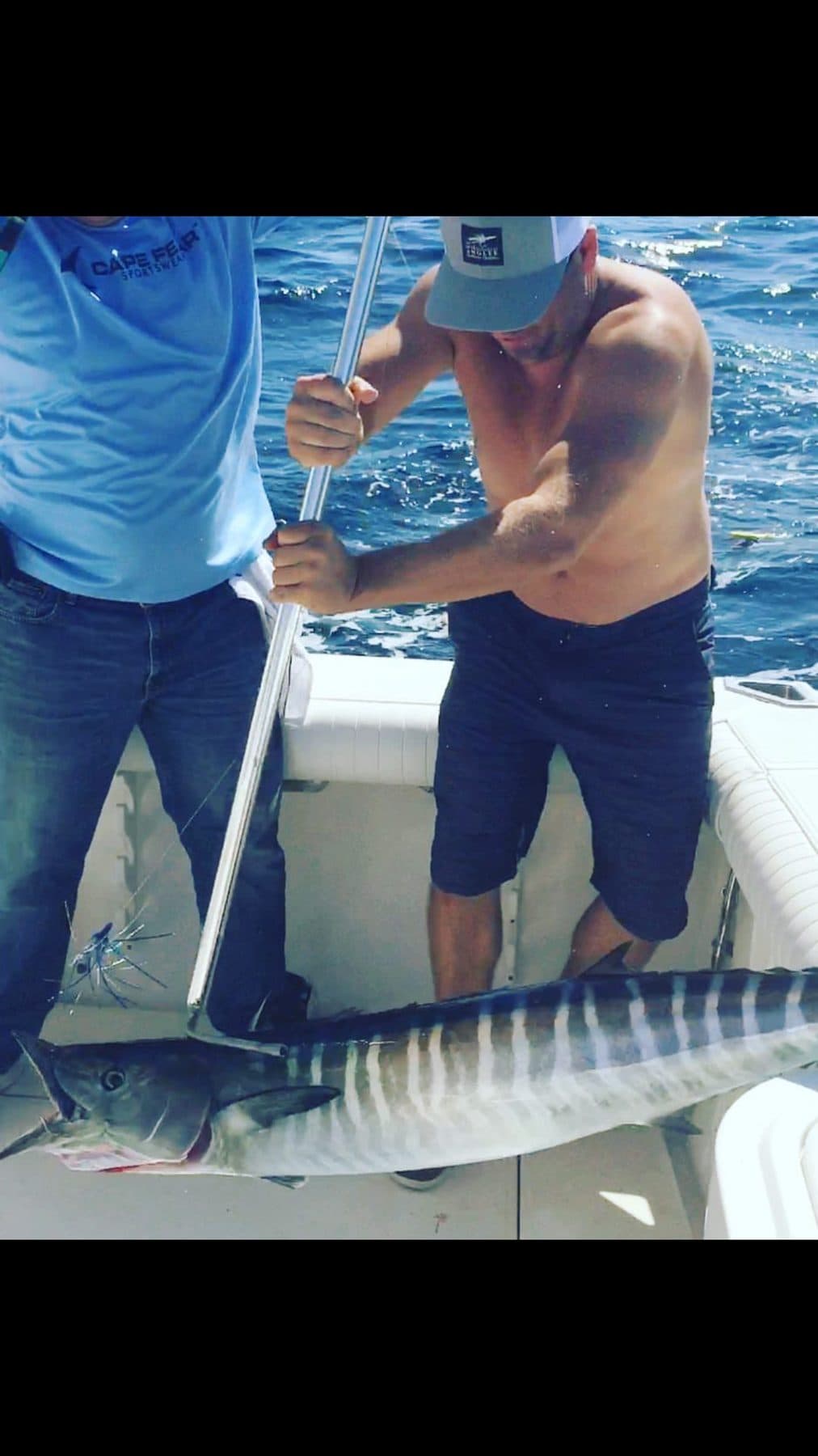 Wahoo gaffed alongside the boat